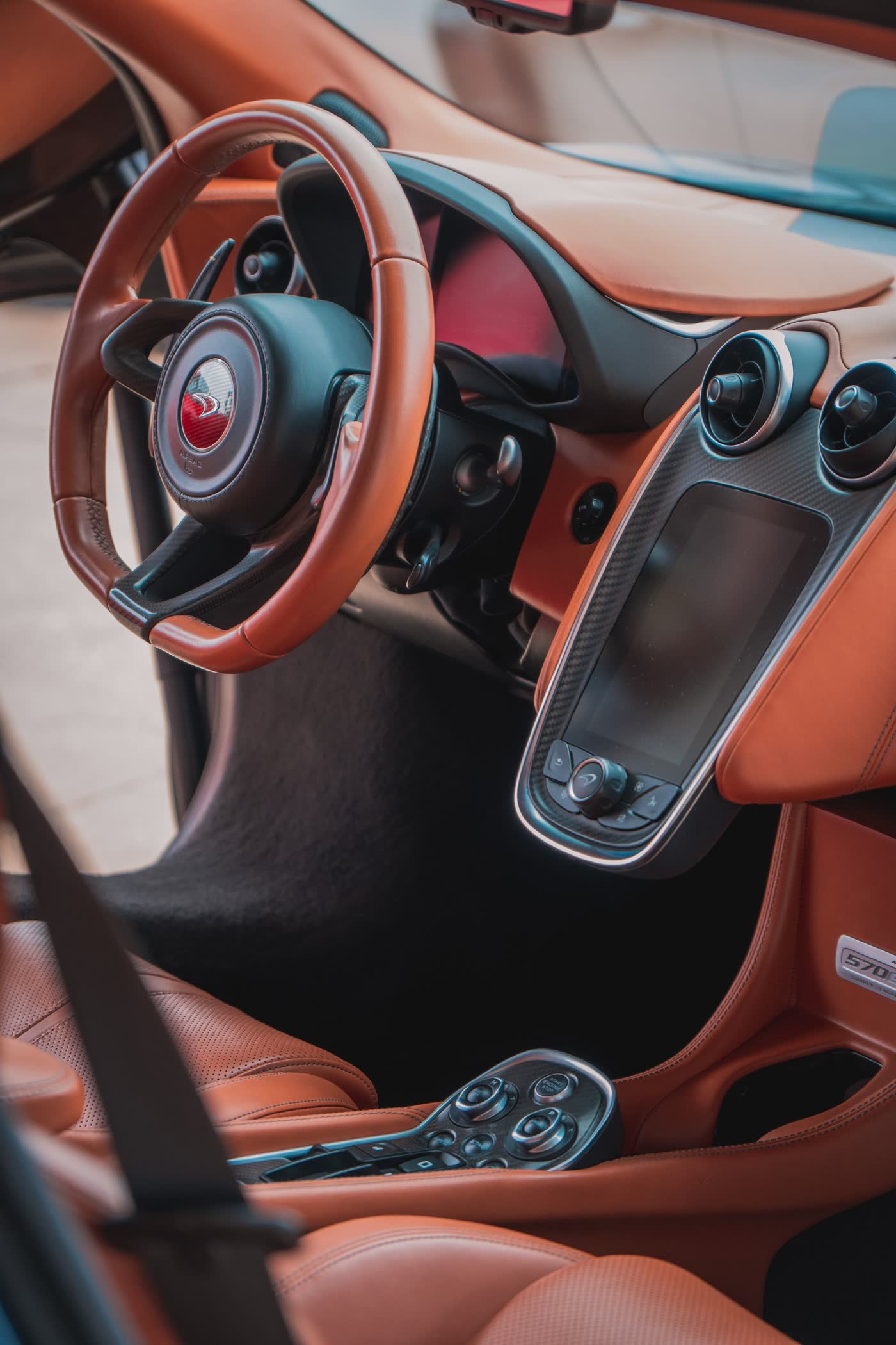 Supercar interior with orange leather after detail